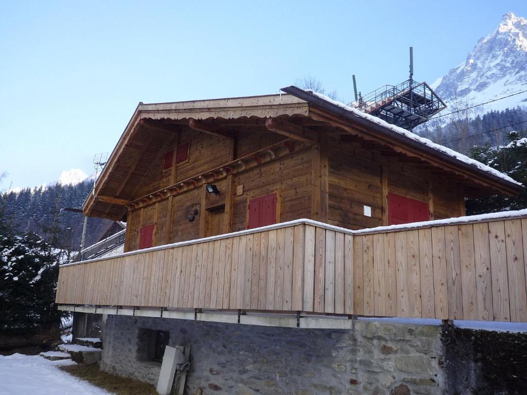 a wooden cabin with snow on the roof at Chalet Evasion by Interhome in Les Bossons