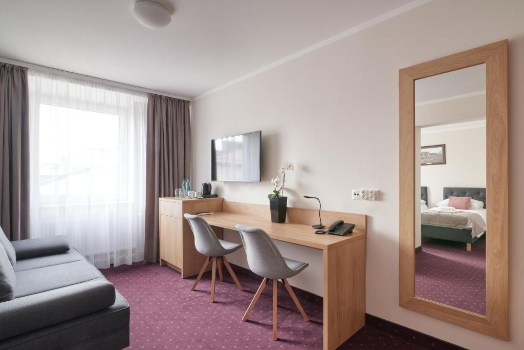 Ein Bett oder Betten in einem Zimmer der Unterkunft Hotel Renesans