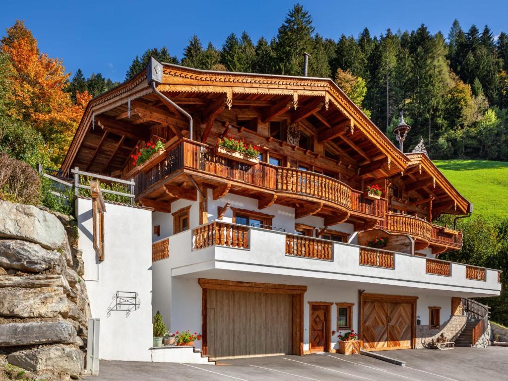 a building with a balcony on top of it at Apartment Chalet Modern Life - MHO769 by Interhome in Ramsau im Zillertal