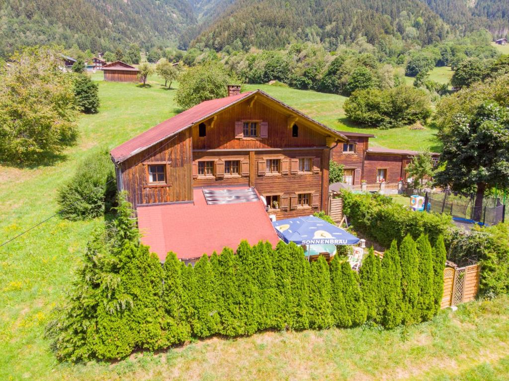 an aerial view of a house with trees in front of it at Apartment Helmreich-3 by Interhome in Sankt Gallenkirch