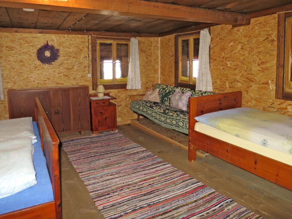 Postel nebo postele na pokoji v ubytování Chalet Lippnerhütte by Interhome