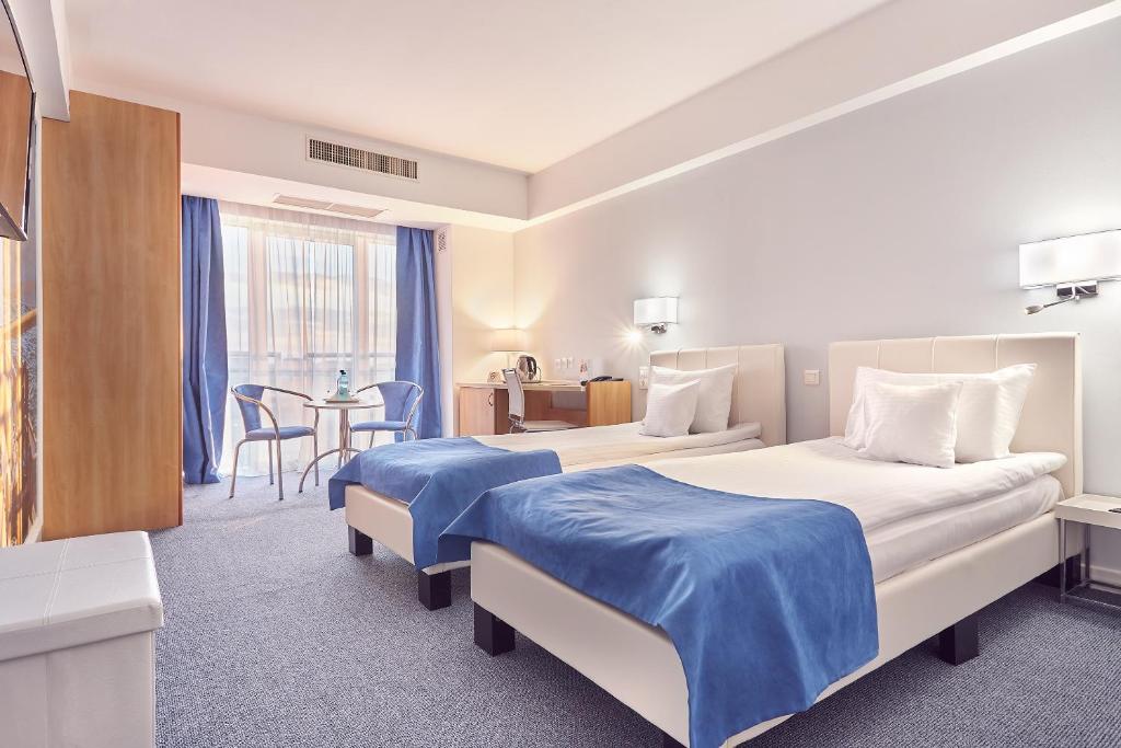 Кровать или кровати в номере Continental Forum Constanta
