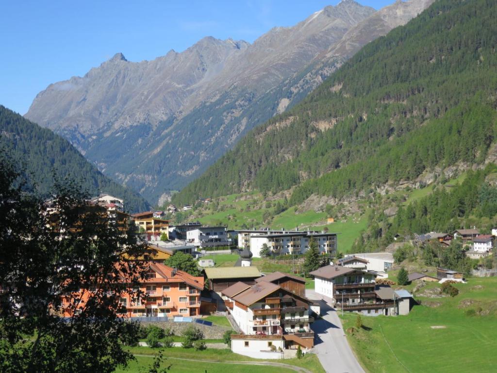 a village in a valley with mountains in the background at Holiday Home Willi - SOE425 by Interhome in Sölden