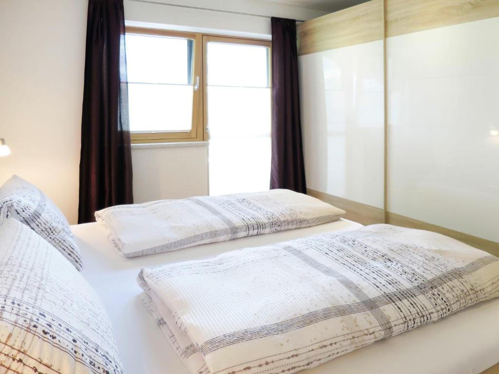 Posteľ alebo postele v izbe v ubytovaní Apartment Gitti by Interhome