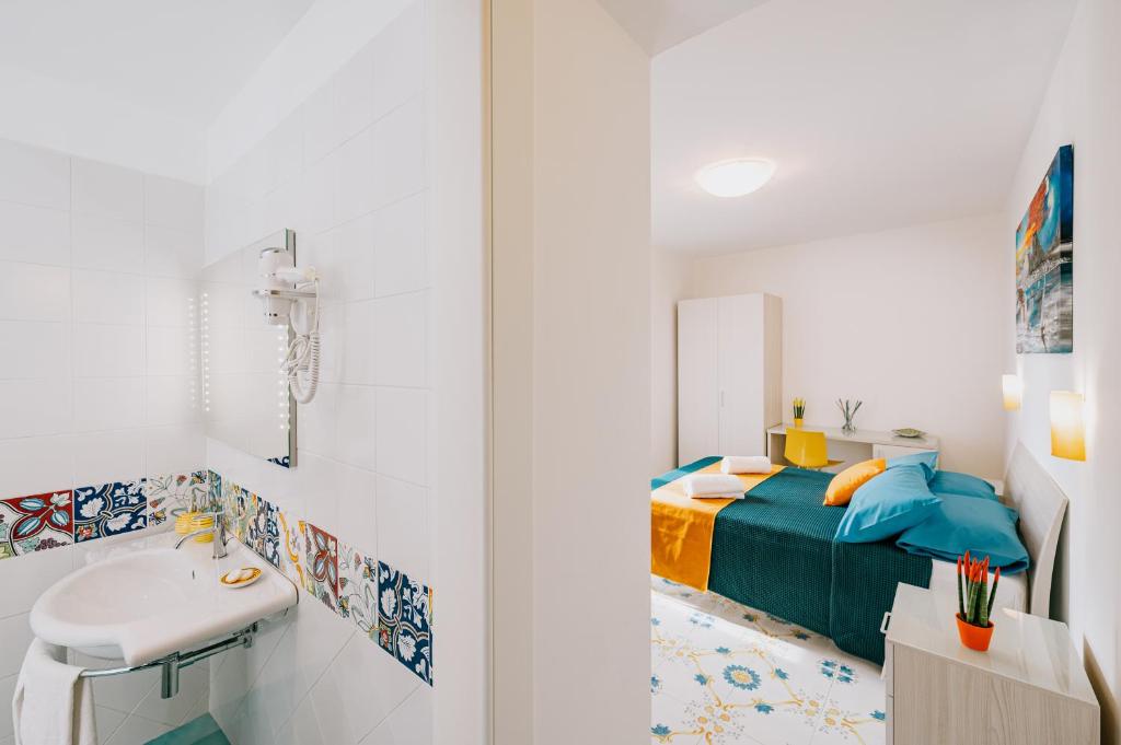 Ein Bett oder Betten in einem Zimmer der Unterkunft Villa Eris Amalfi Coast