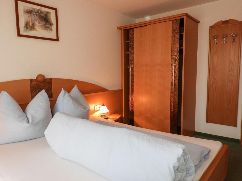 A bed or beds in a room at Apartment Bergfeld-2 by Interhome