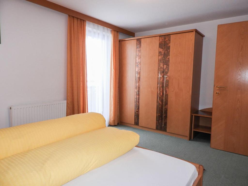 A bed or beds in a room at Apartment Bergfeld-2 by Interhome