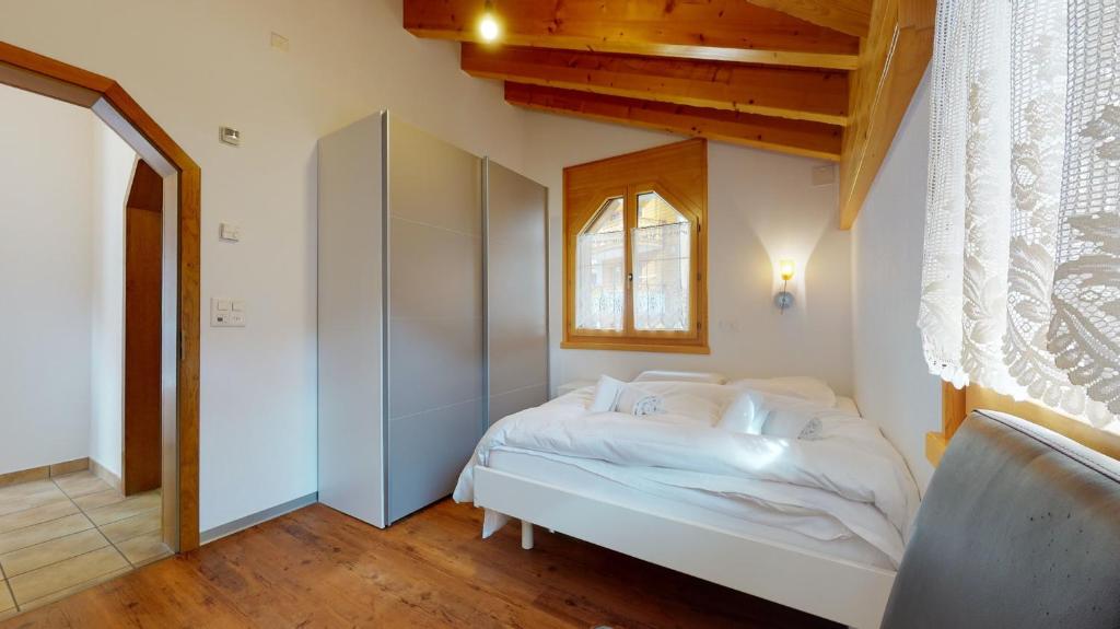 Postel nebo postele na pokoji v ubytování Villa Octogon, 2 Bedrooms, ideally located in Leukerbad