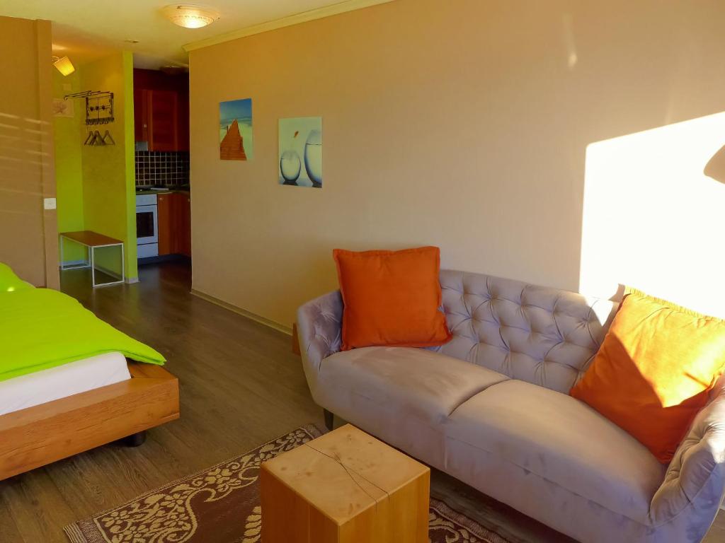 a living room with a couch and a table at Apartment Jeanne D'Arc Apt- C-28 by Interhome in Crans-Montana