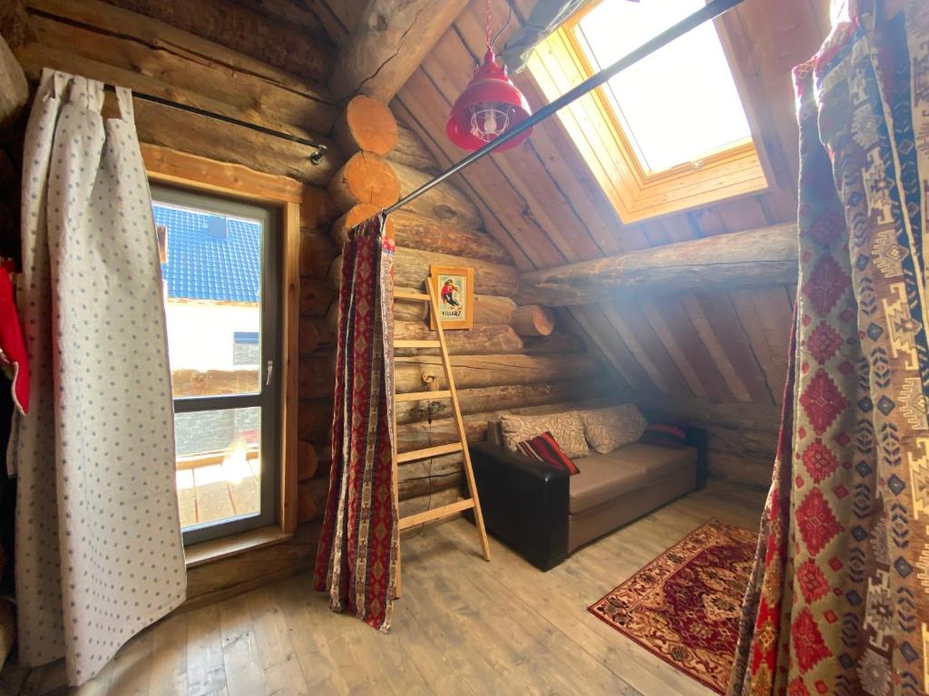 Кровать или кровати в номере Mountain Cricket Chalets and Apartments Gudauri