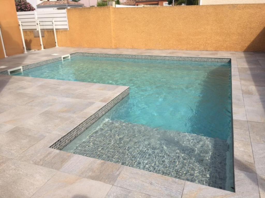 a swimming pool in the middle of a building at Villa l'Occitane by Interhome in Agde