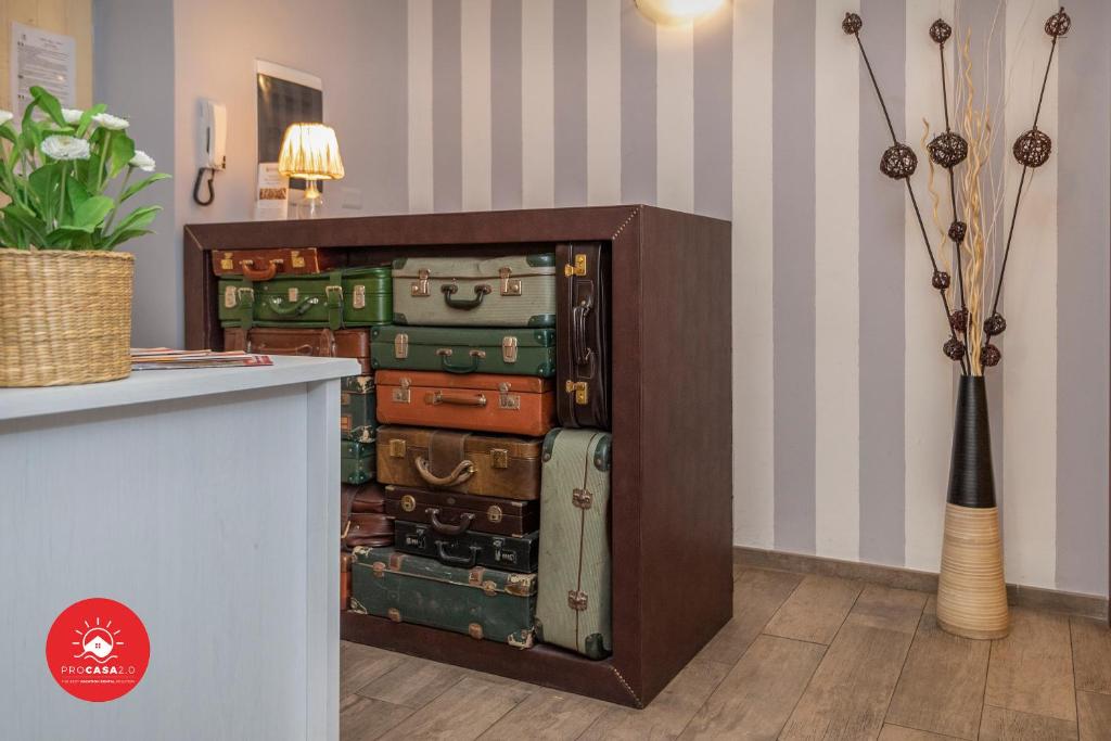 a cabinet filled with lots of suitcases in a room at Affittacamere Il Viaggiatore in La Spezia