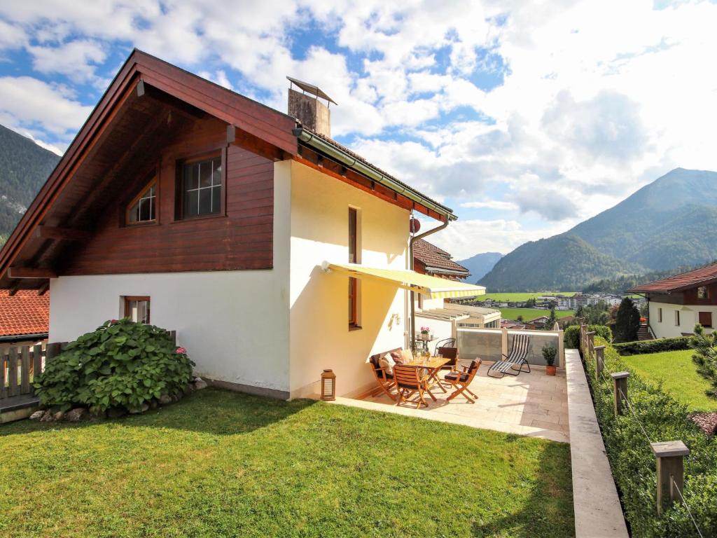 a house with a view of the mountains at Holiday Home Seekarblick by Interhome in Achenkirch