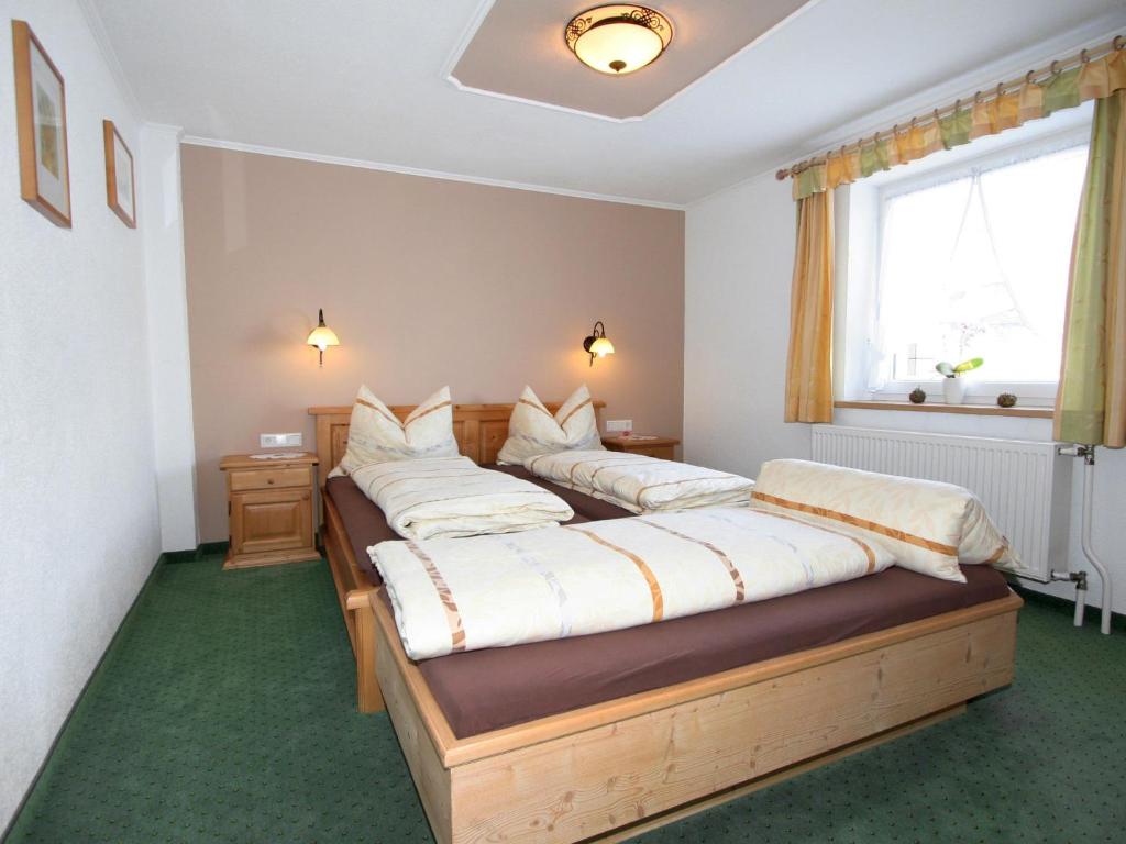 Postel nebo postele na pokoji v ubytování Apartment Fabian by Interhome