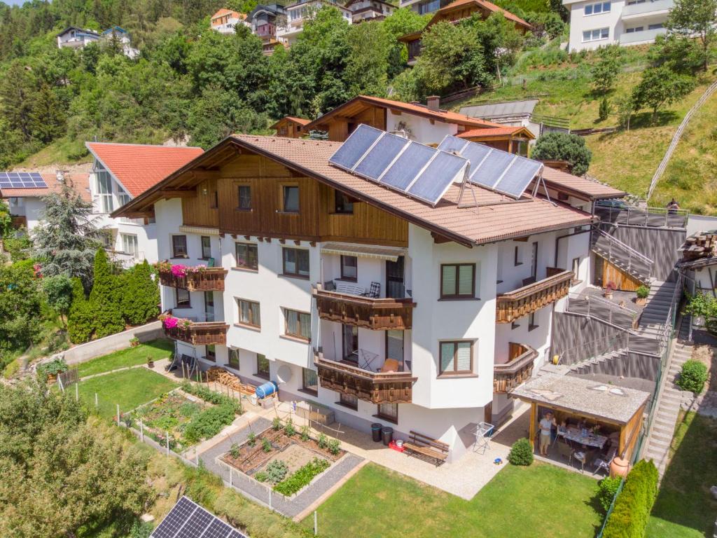 an aerial view of a house with solar panels on the roof at Apartment Venet by Interhome in Fliess