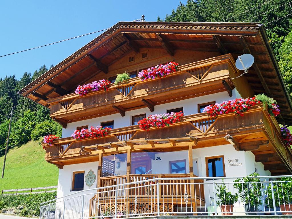 a house with flower boxes on the balcony at Apartment Gruber by Interhome in Mühlen