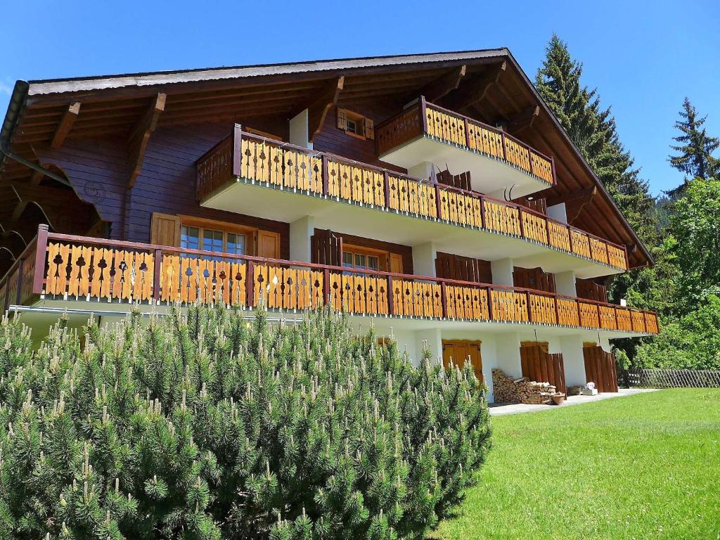 a large house with a balcony on the side of it at Apartment Sapin Bleu 6 by Interhome in Villars-sur-Ollon