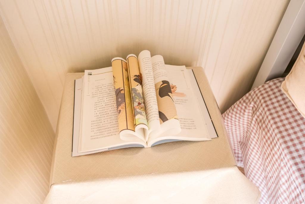 Postel nebo postele na pokoji v ubytování Yu Jing Xuan Boutique Apartment