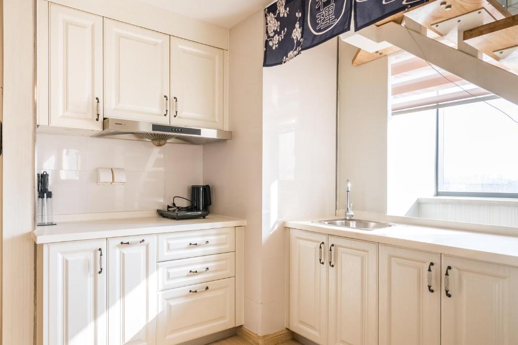 Kuchyň nebo kuchyňský kout v ubytování Yu Jing Xuan Boutique Apartment