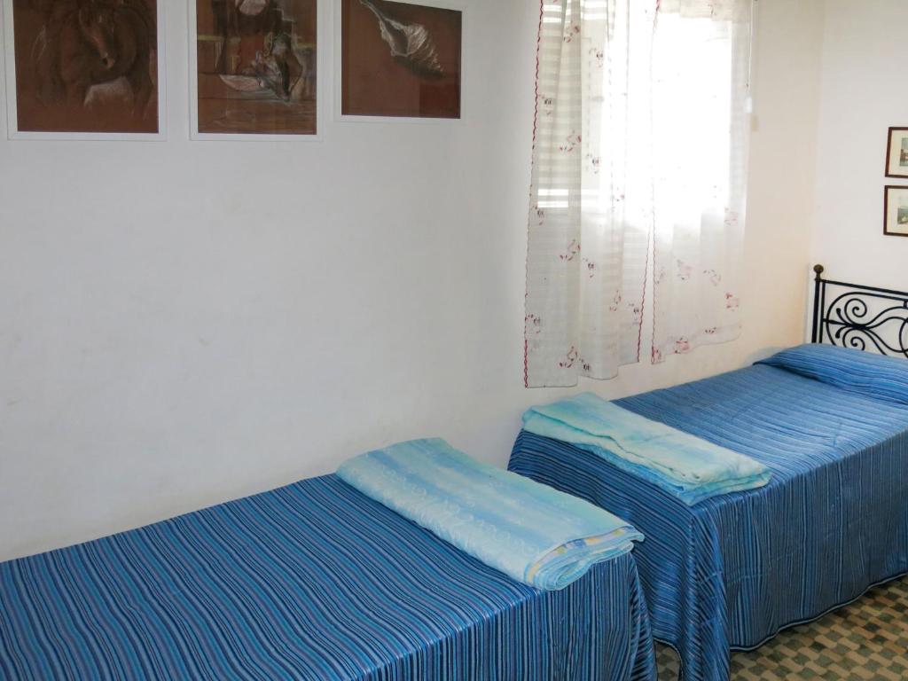 A bed or beds in a room at Apartment Sulla Scogliera by Interhome