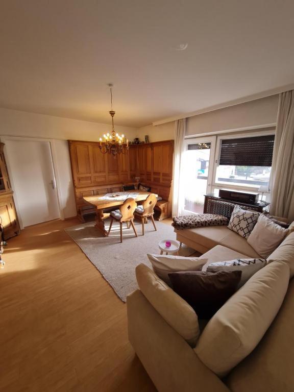 a living room with a couch and a table at Appartement THERESE by MoniCare in Seefeld in Tirol