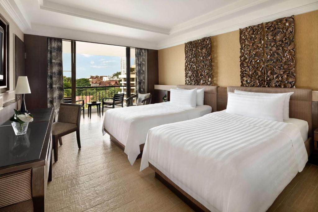 Voodi või voodid majutusasutuse Shangri-La Golden Sands, Penang toas