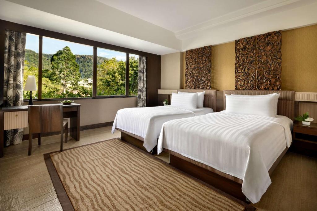 Voodi või voodid majutusasutuse Shangri-La Golden Sands, Penang toas