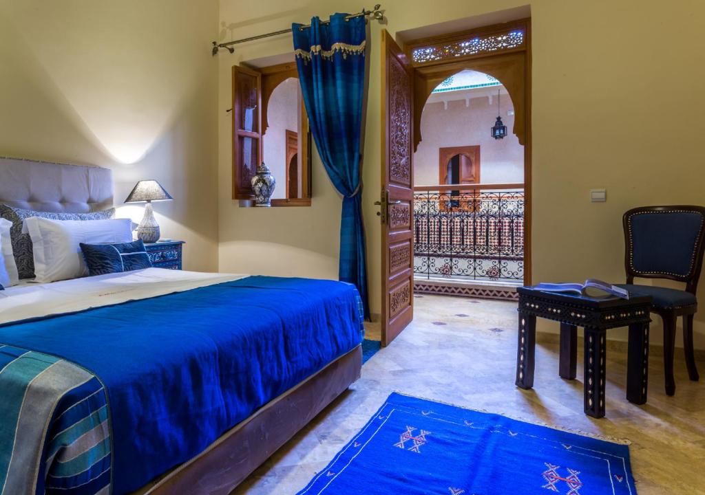 Postel nebo postele na pokoji v ubytování Riad Des Nations