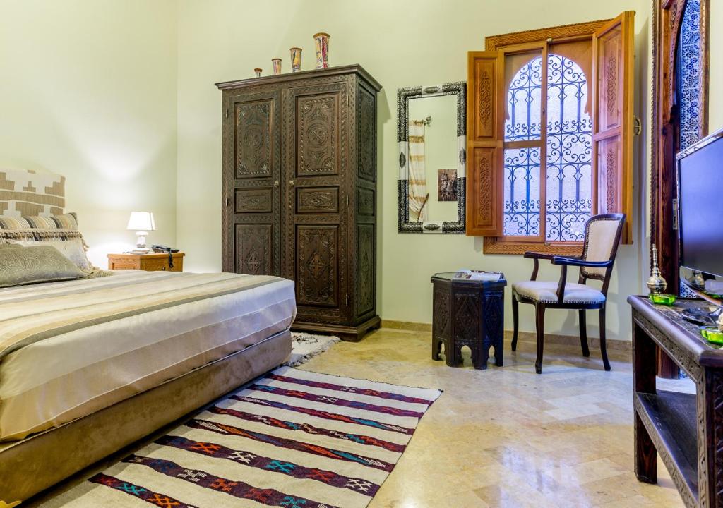 Postel nebo postele na pokoji v ubytování Riad Des Nations