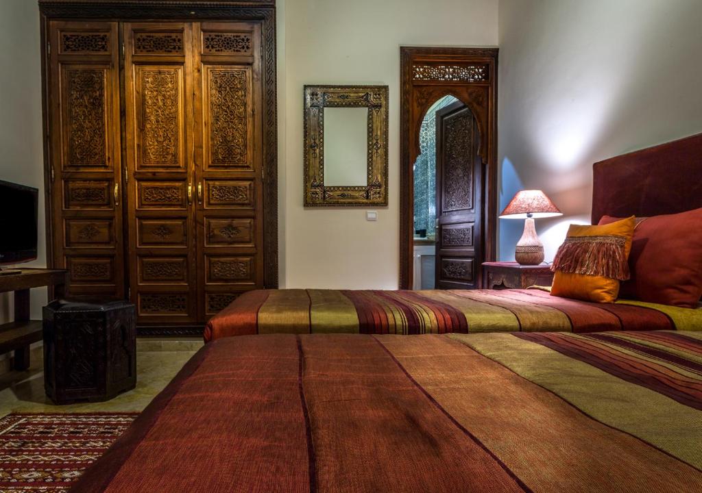 Postel nebo postele na pokoji v ubytování Riad Des Nations
