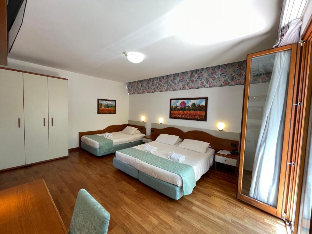 Een bed of bedden in een kamer bij Hotel Meridiana