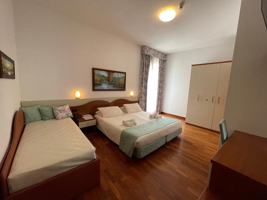 Een bed of bedden in een kamer bij Hotel Meridiana
