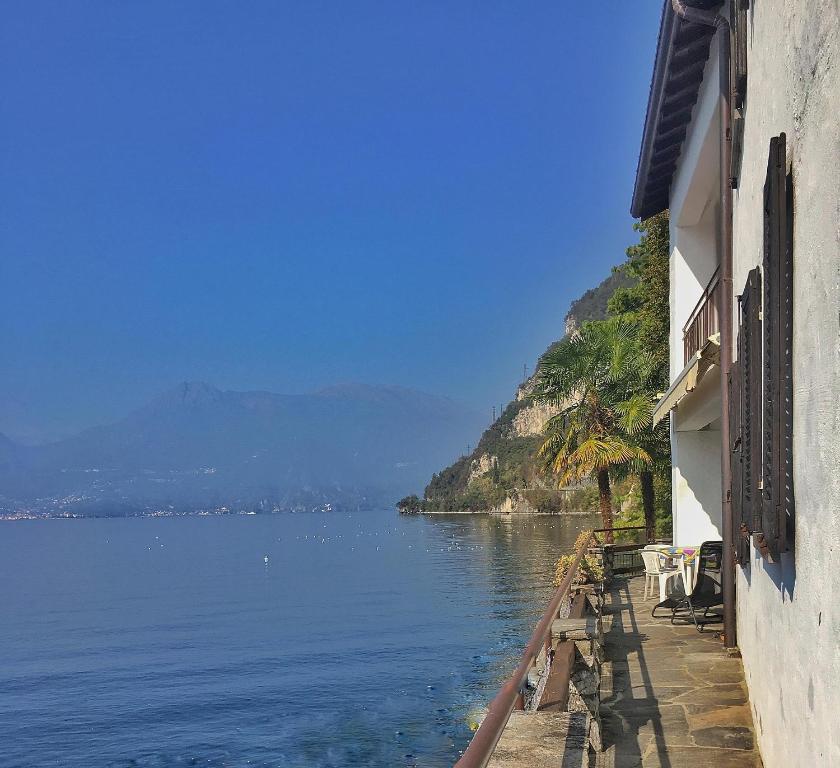 a view of a body of water next to a building at Gioconda Villa in Varenna