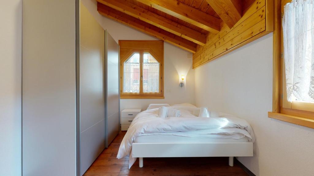 Postel nebo postele na pokoji v ubytování Villa Octogon, 2 Bedrooms, ideally located in Leukerbad