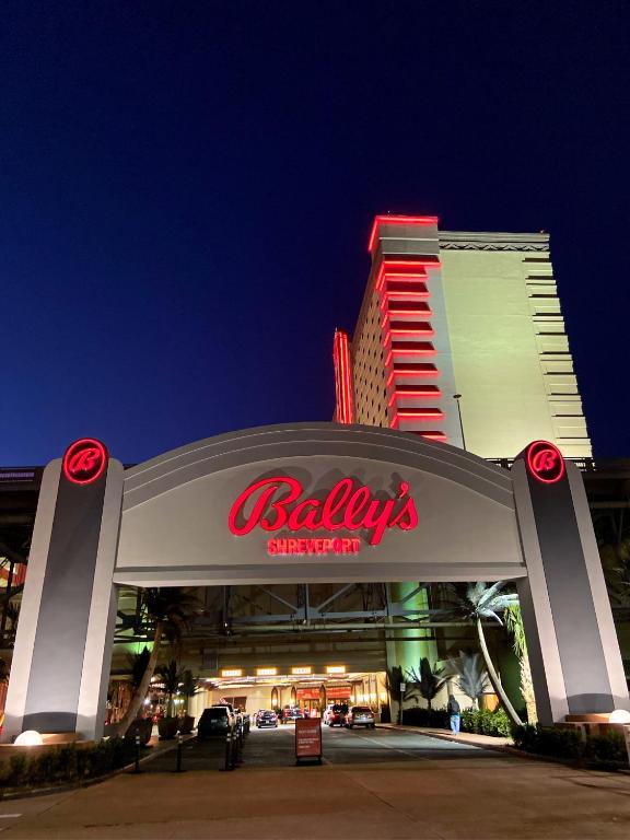 a shopping center with a bibliography sign in front of a building at Bally's Shreveport Casino & Hotel in Shreveport