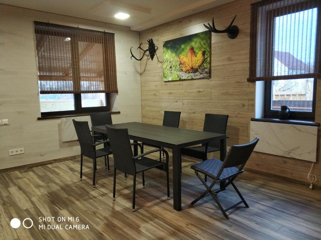 a dining room with a table and chairs at Home and SPA in Kyiv