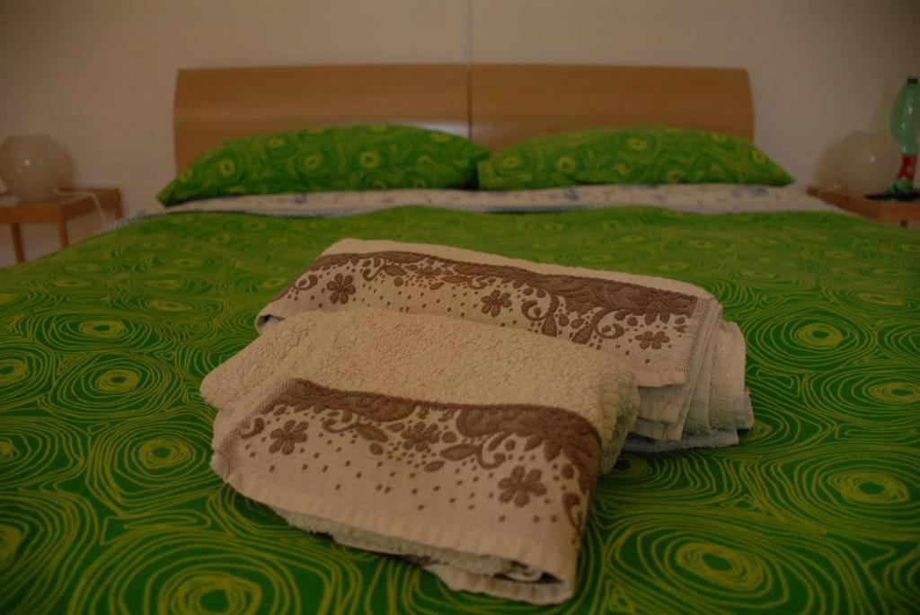 Postel nebo postele na pokoji v ubytování Fattoria Nonno Neno B&B