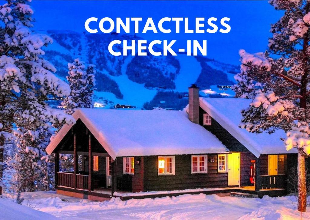 a house in the snow with the words confidence check in at Geilolia Hyttetun in Geilo
