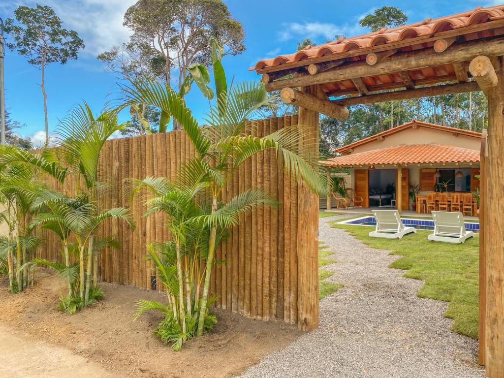 a wooden fence in front of a house at CASA RENASCER in Trancoso