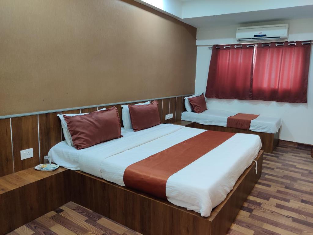 Postel nebo postele na pokoji v ubytování Hotel Nova Prime
