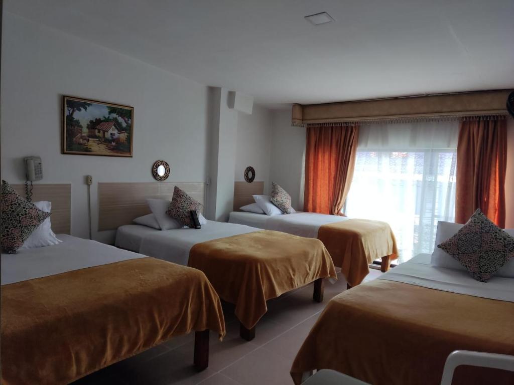 Postel nebo postele na pokoji v ubytování Hotel Mirador Plaza