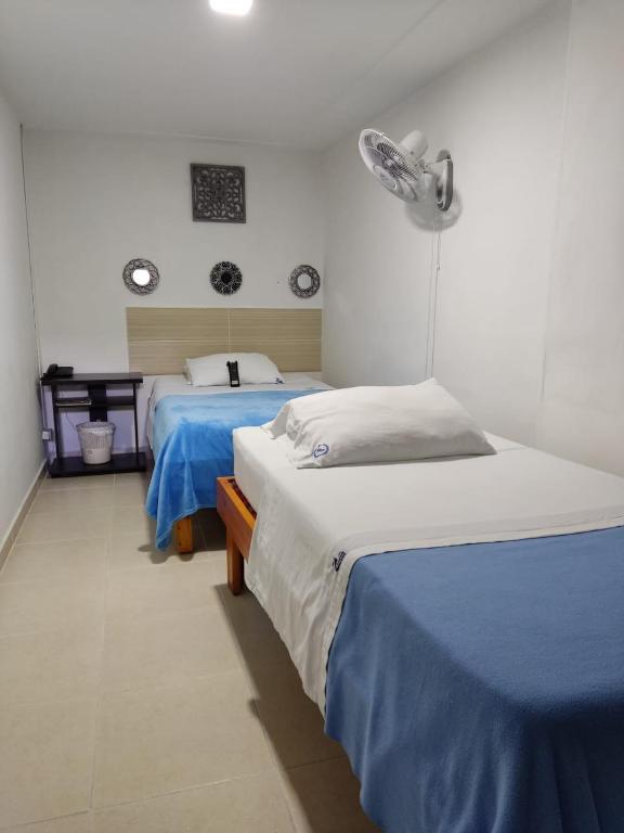 Postel nebo postele na pokoji v ubytování Hotel Mirador Plaza