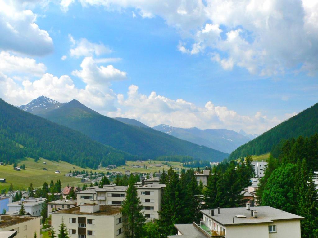 a view of a town in a valley with mountains at Apartment Parkareal - Utoring-13 by Interhome in Davos