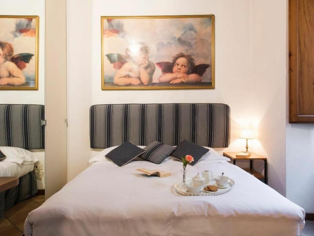 A bed or beds in a room at Georgofili by Halldis