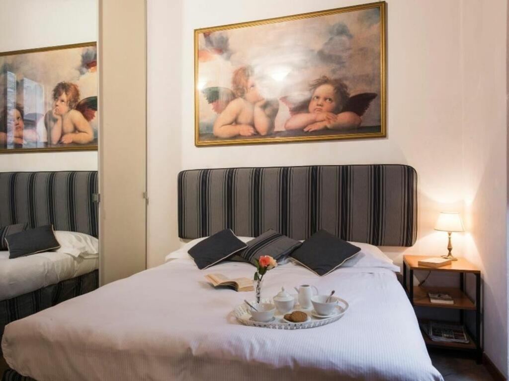 A bed or beds in a room at Georgofili by Halldis