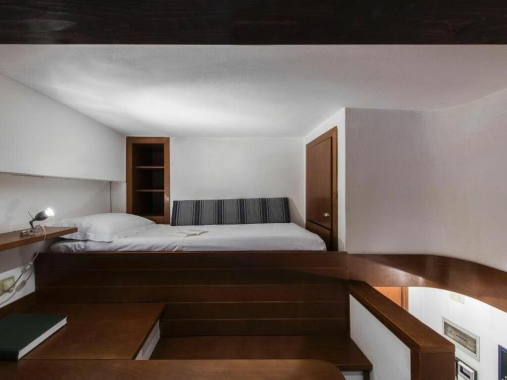 A bed or beds in a room at Georgofili by Halldis