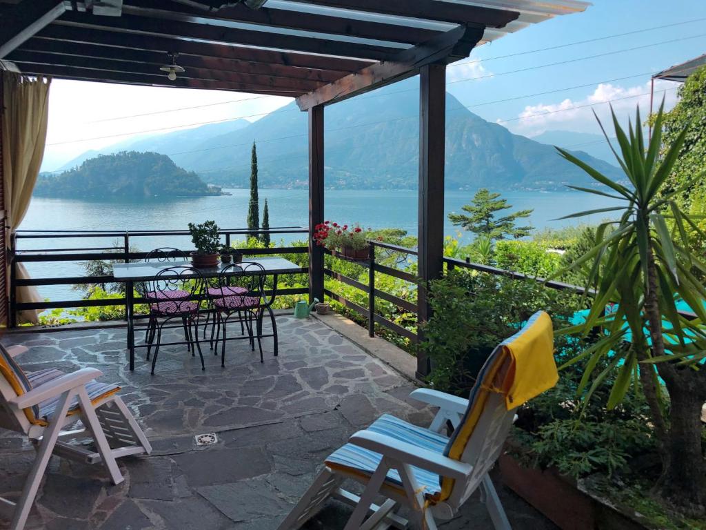 a patio with chairs and a table with a view at Apartment Stefania - VNA370 by Interhome in Varenna