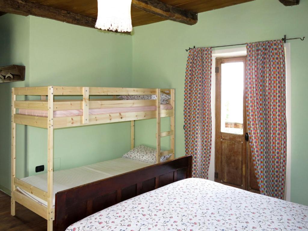 Łóżko lub łóżka w pokoju w obiekcie Holiday Home Casetta by Interhome