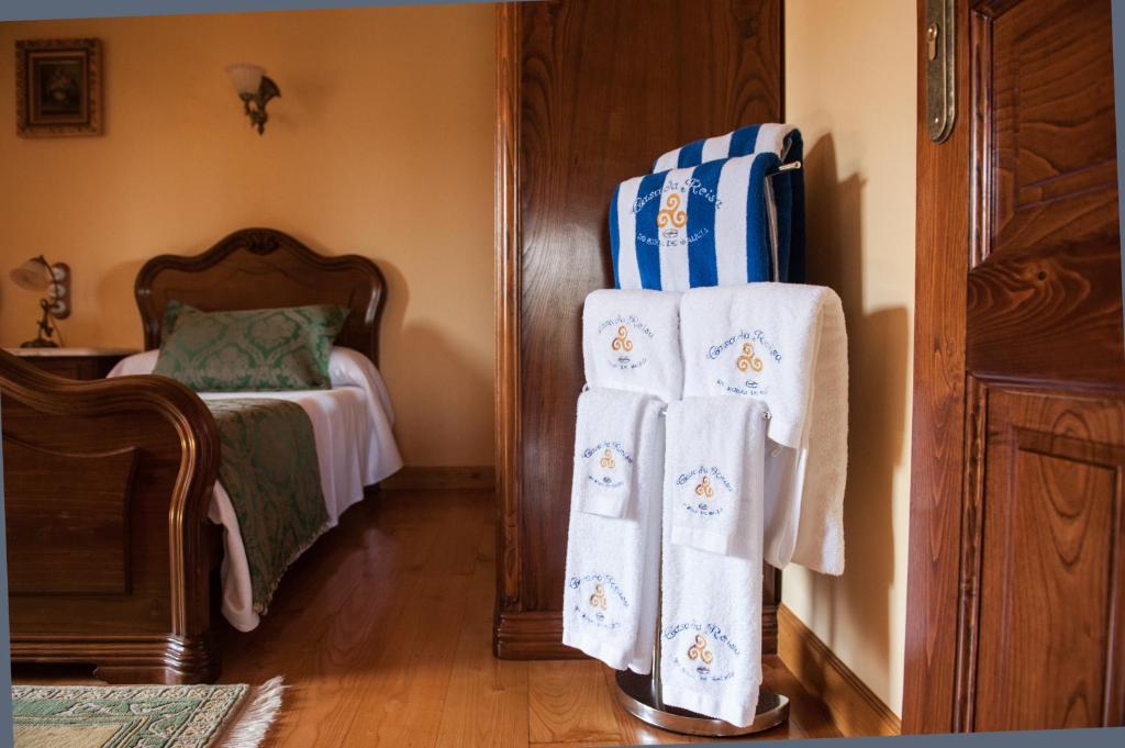 Łóżko lub łóżka w pokoju w obiekcie Casa da Roisa
