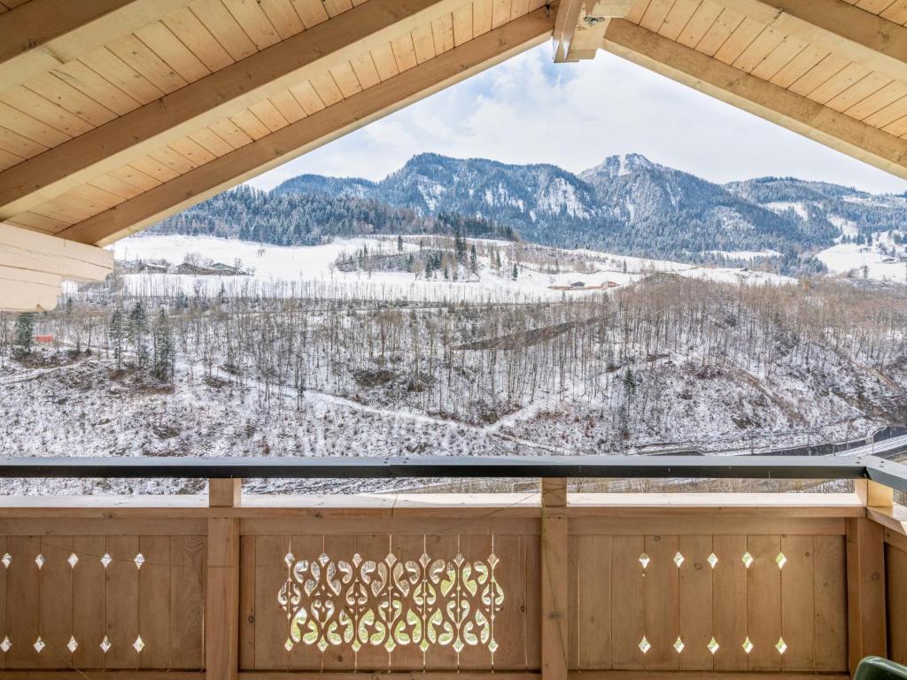 a view of a snowy mountain from a window at Apartment Achtalgut-1 by Interhome in Lend